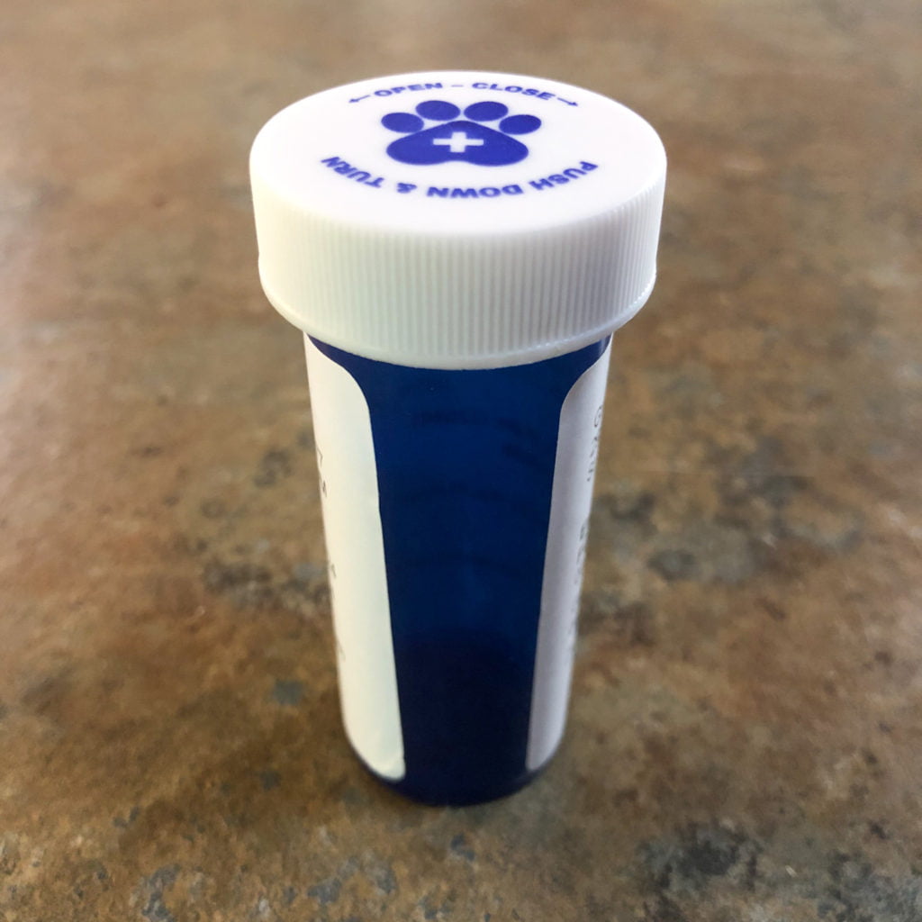 Blue and white prescription bottle for animals from the vet.